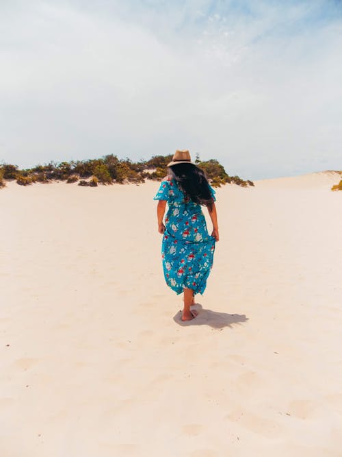 Woman Walking on a Dune 