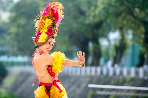 Woman in Traditional Clothing Dancing 