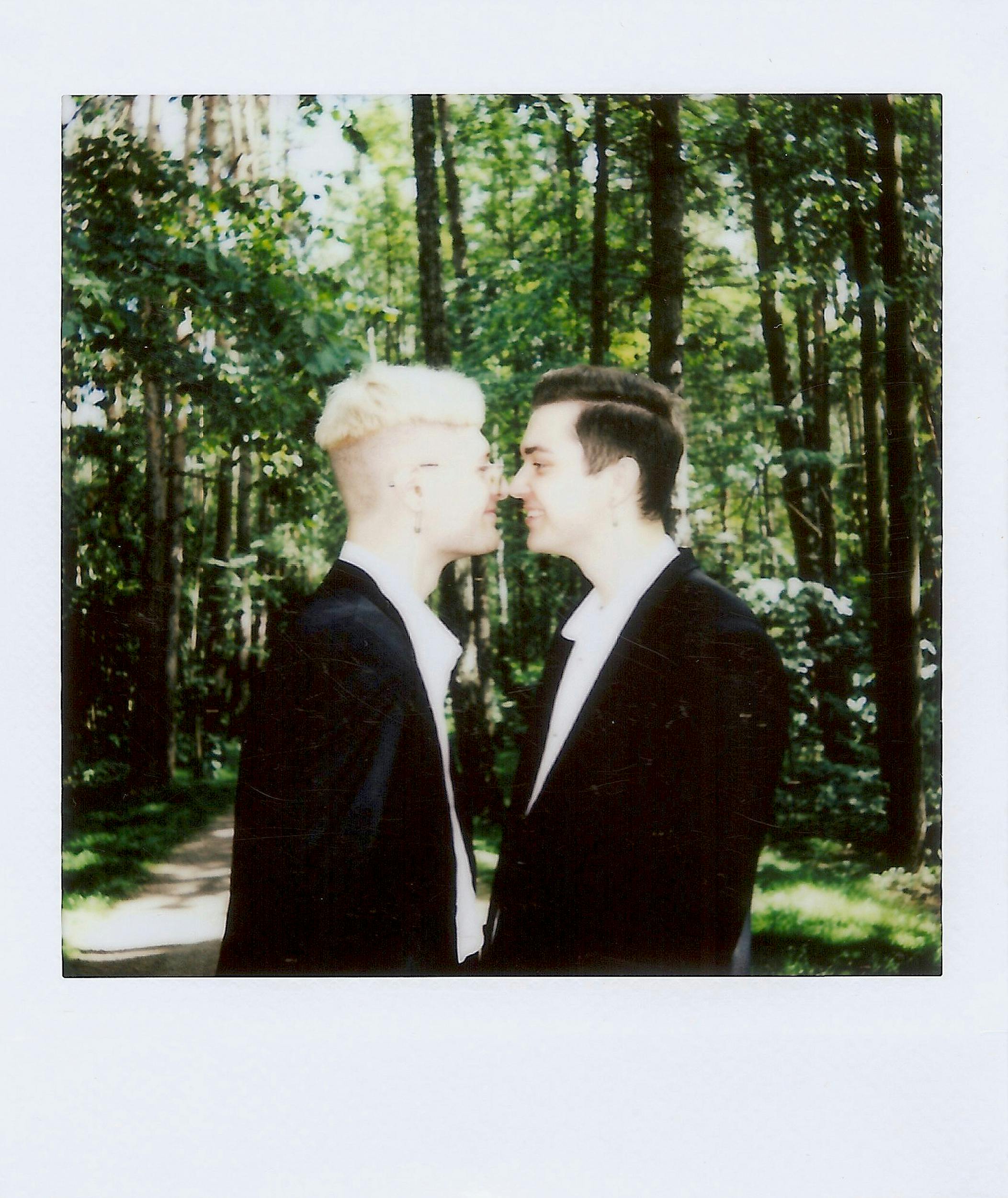 polaroid photo of a couple kissing