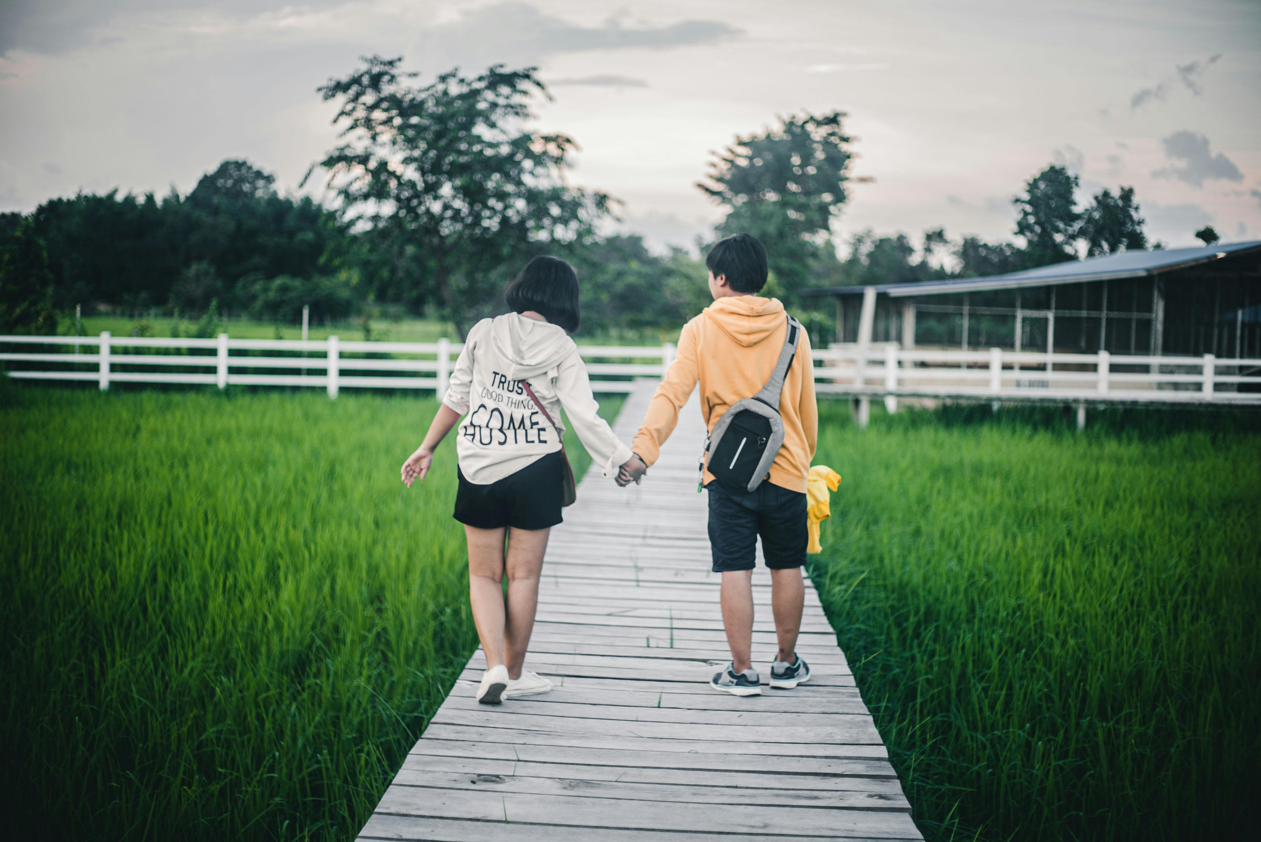 back view of couple on rice field