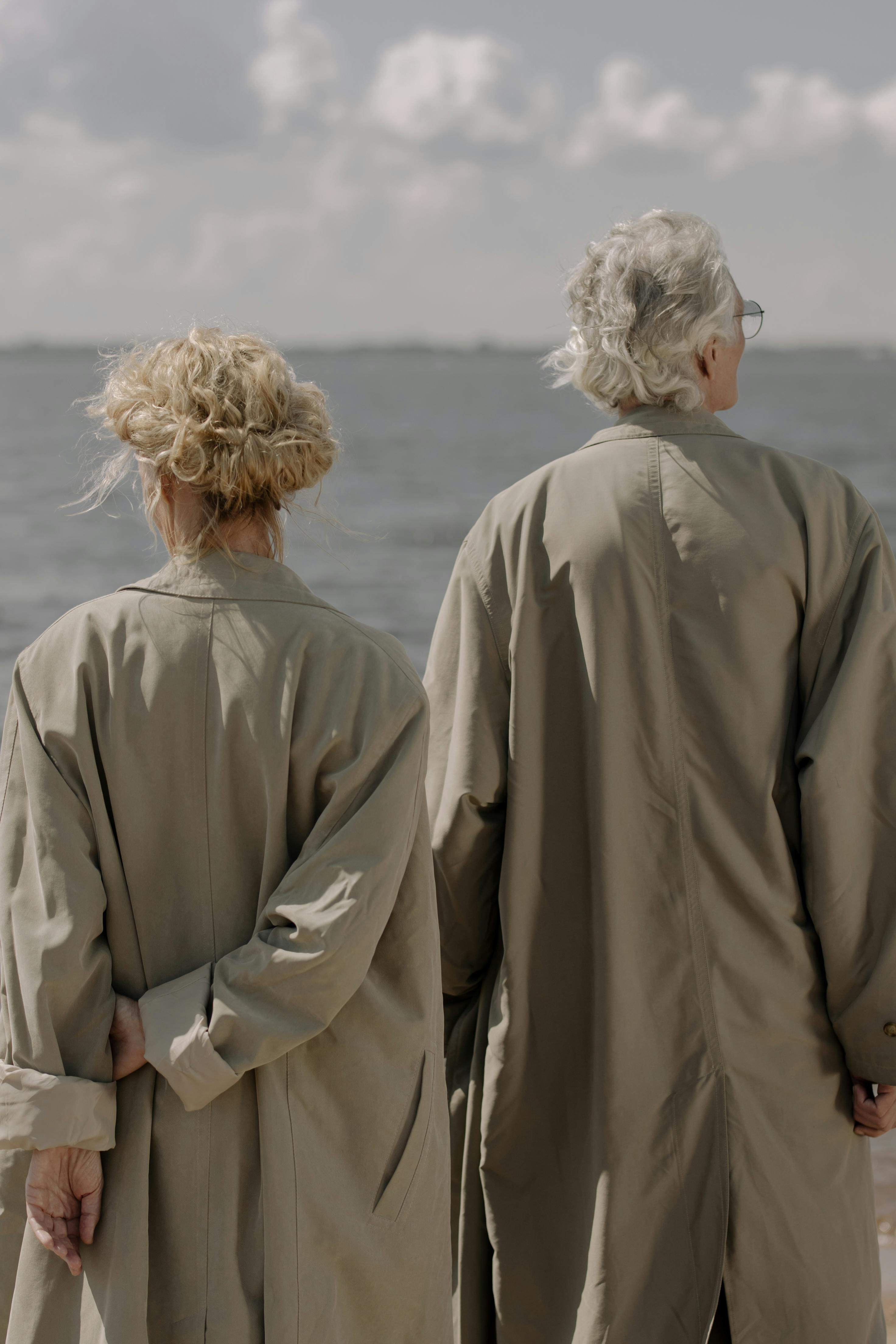 two people in brown trench coats