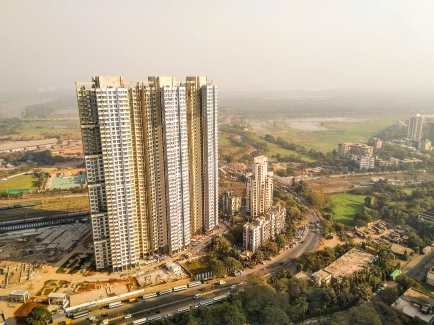 Aerial shot of towering skyscrapers in Mumbai showcasing urban architecture and cityscape.