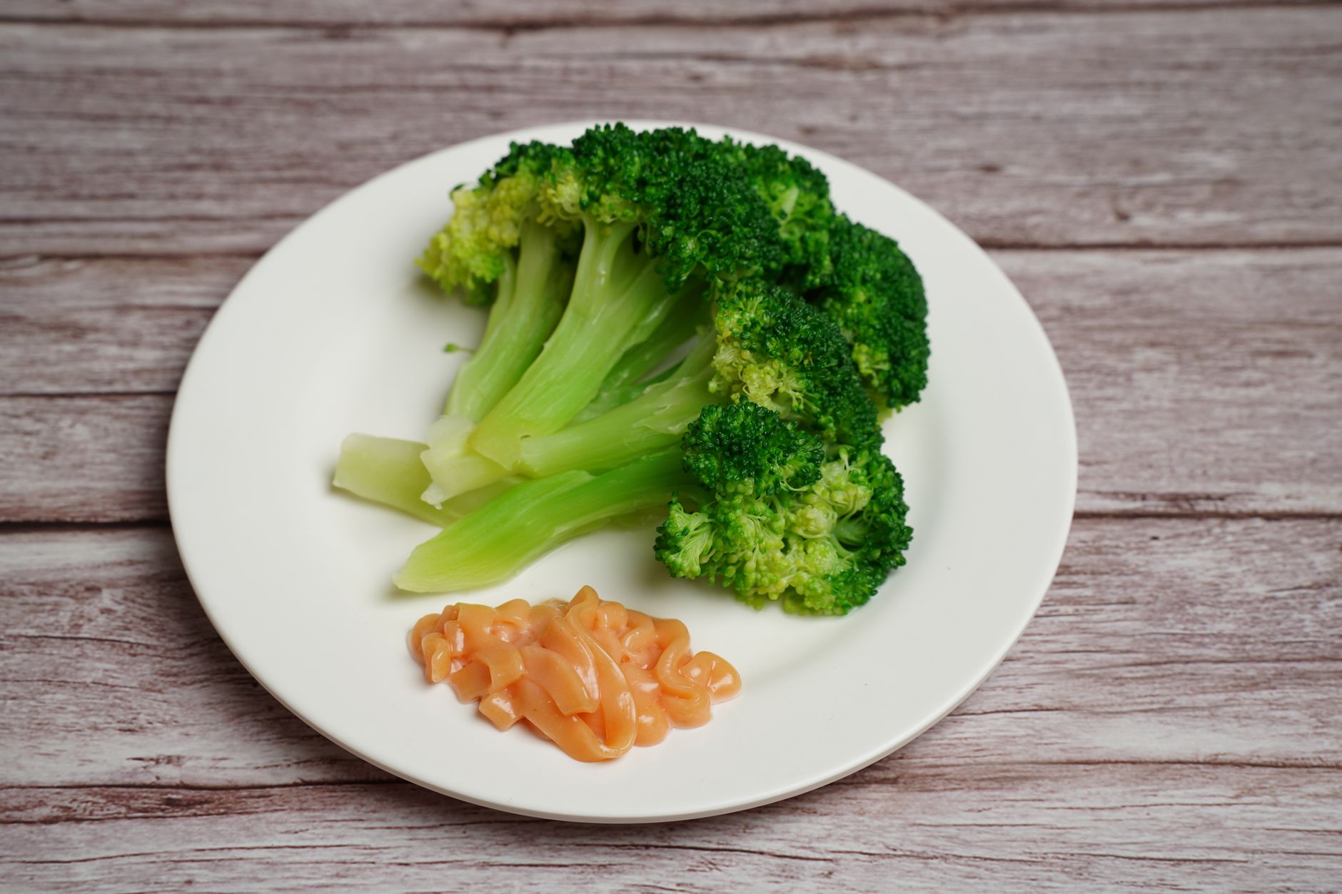 Fresh broccoli on wooden surface ready for steaming