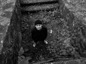 Man in Casual Wear Posing in Abandoned Place