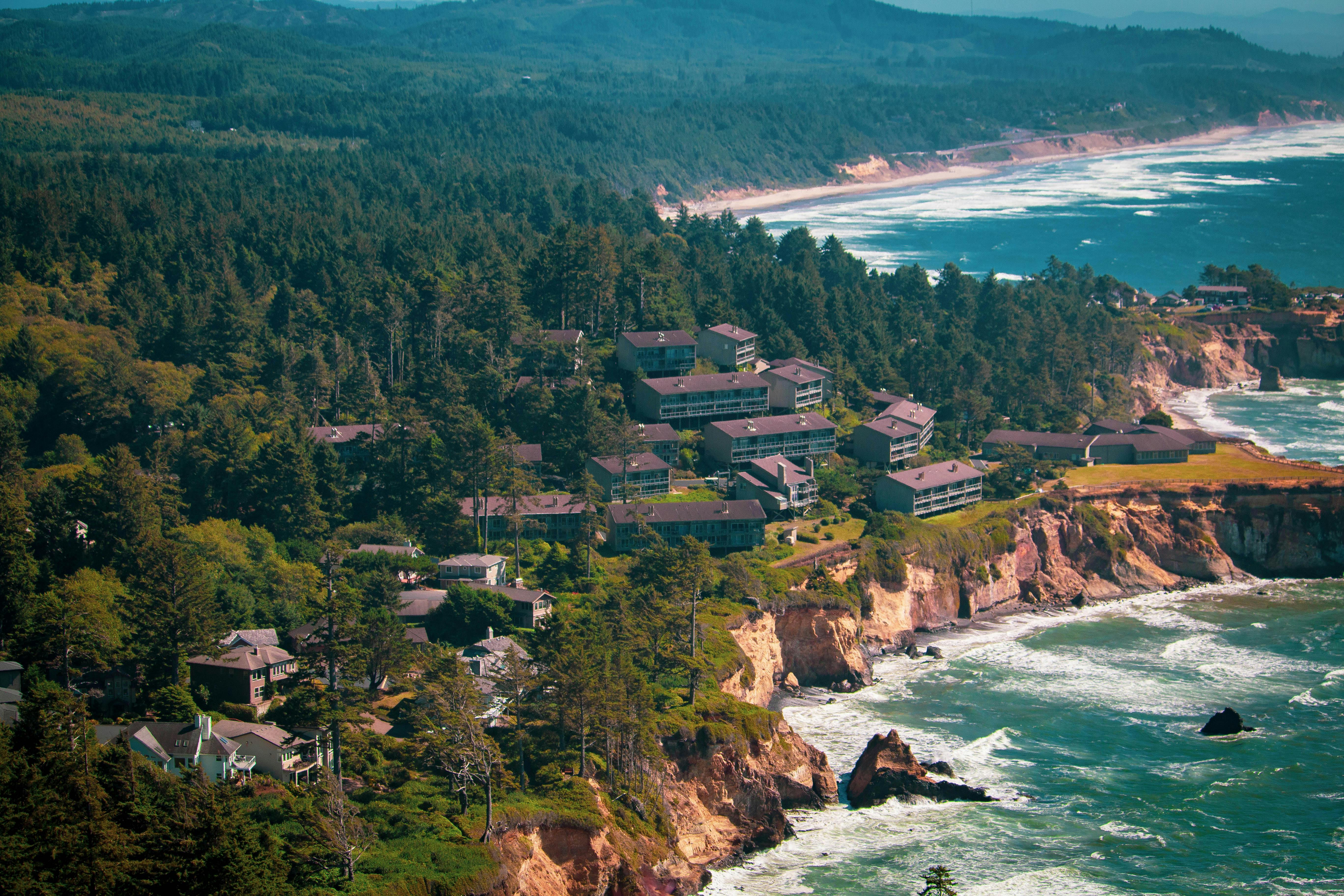 aerial view of a village on a coastal cliff