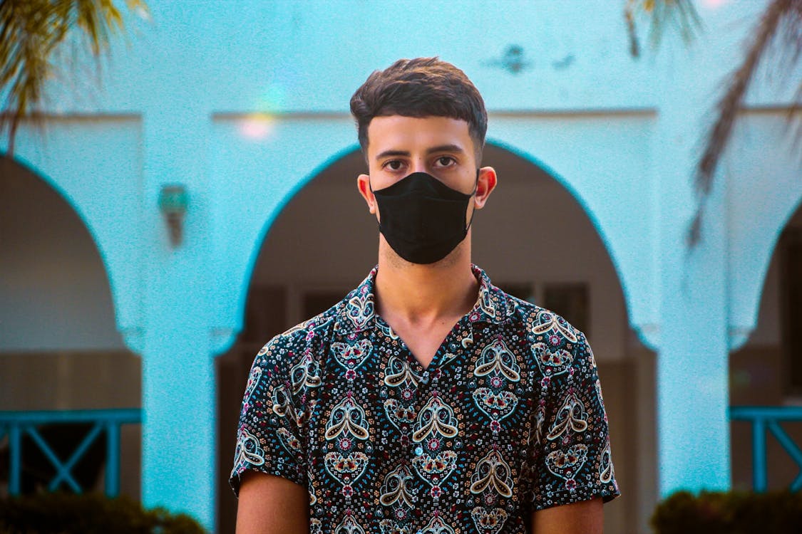 Man in Paisley Polo Wearing a Mask