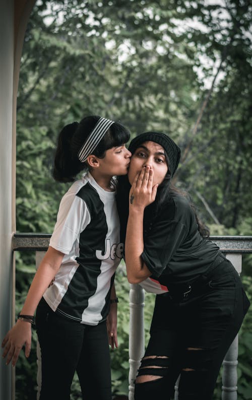 A Woman Kissing Her Friend 