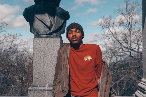 Man in Brown Jacket and Red Long Sleeve Shirt