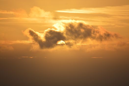 Captivating sunrise behind clouds over Faial, Madeira. Perfect for nature and travel imagery.