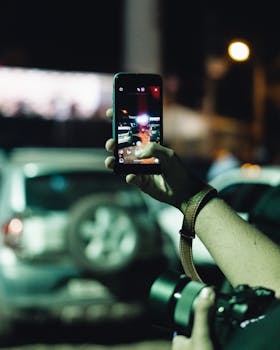 Capturing the city nightlife using a smartphone camera with a focus on vehicles.