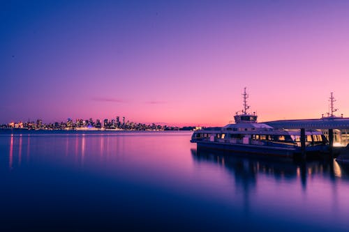 A Yacht Docked on the Port during Sunset