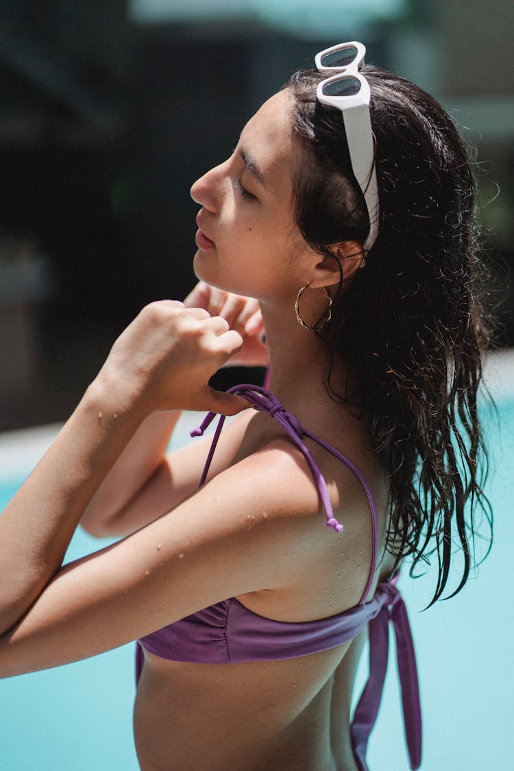 Attractive Woman Chilling In Pool And Touching Swimsuit Bra Straps