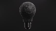 Grayscale Photo of a Light Bulb
