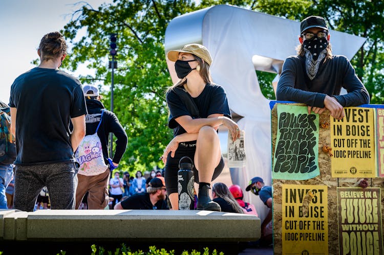 Group Of People In Masks On Protest