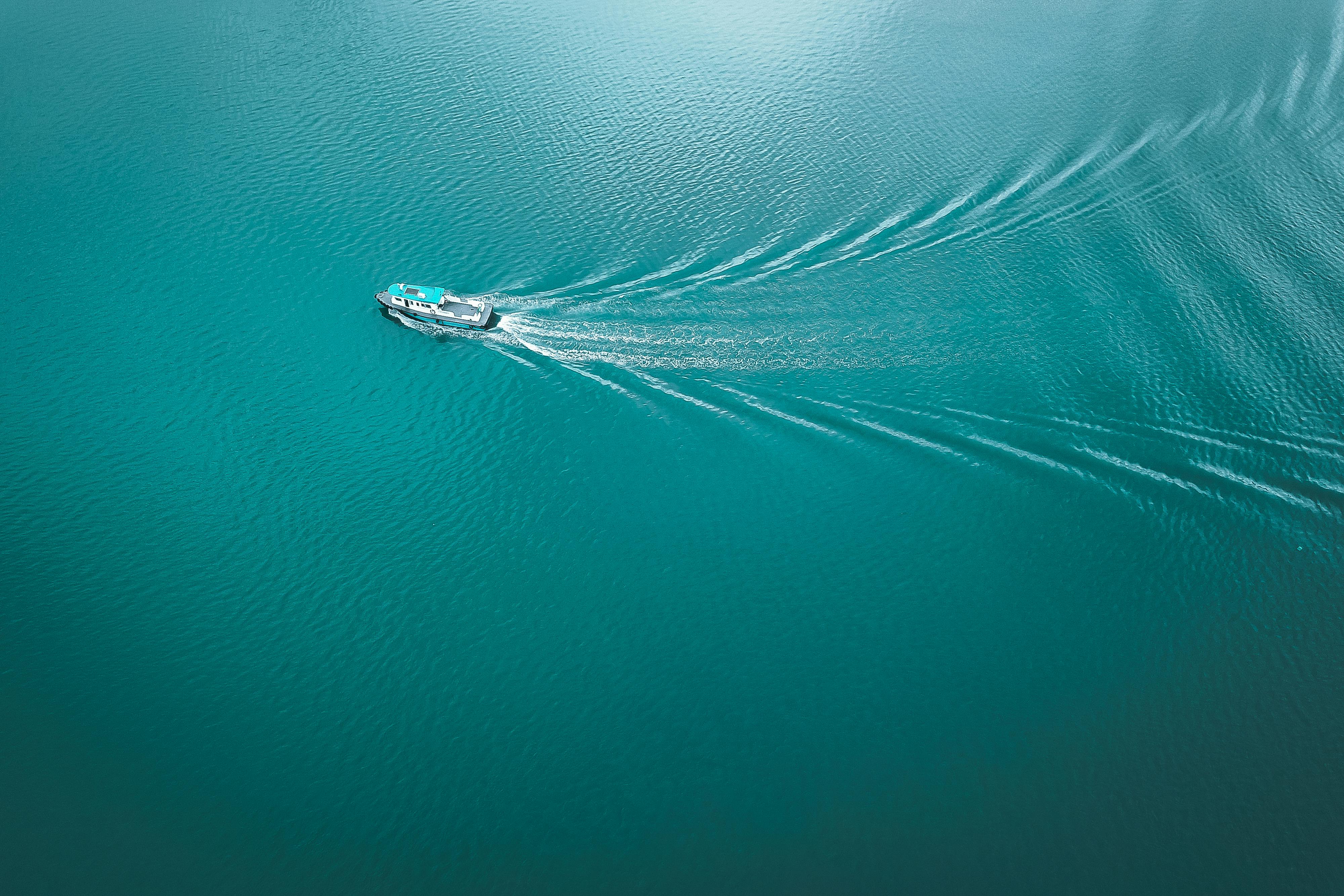 motorboat floating in turquoise sea