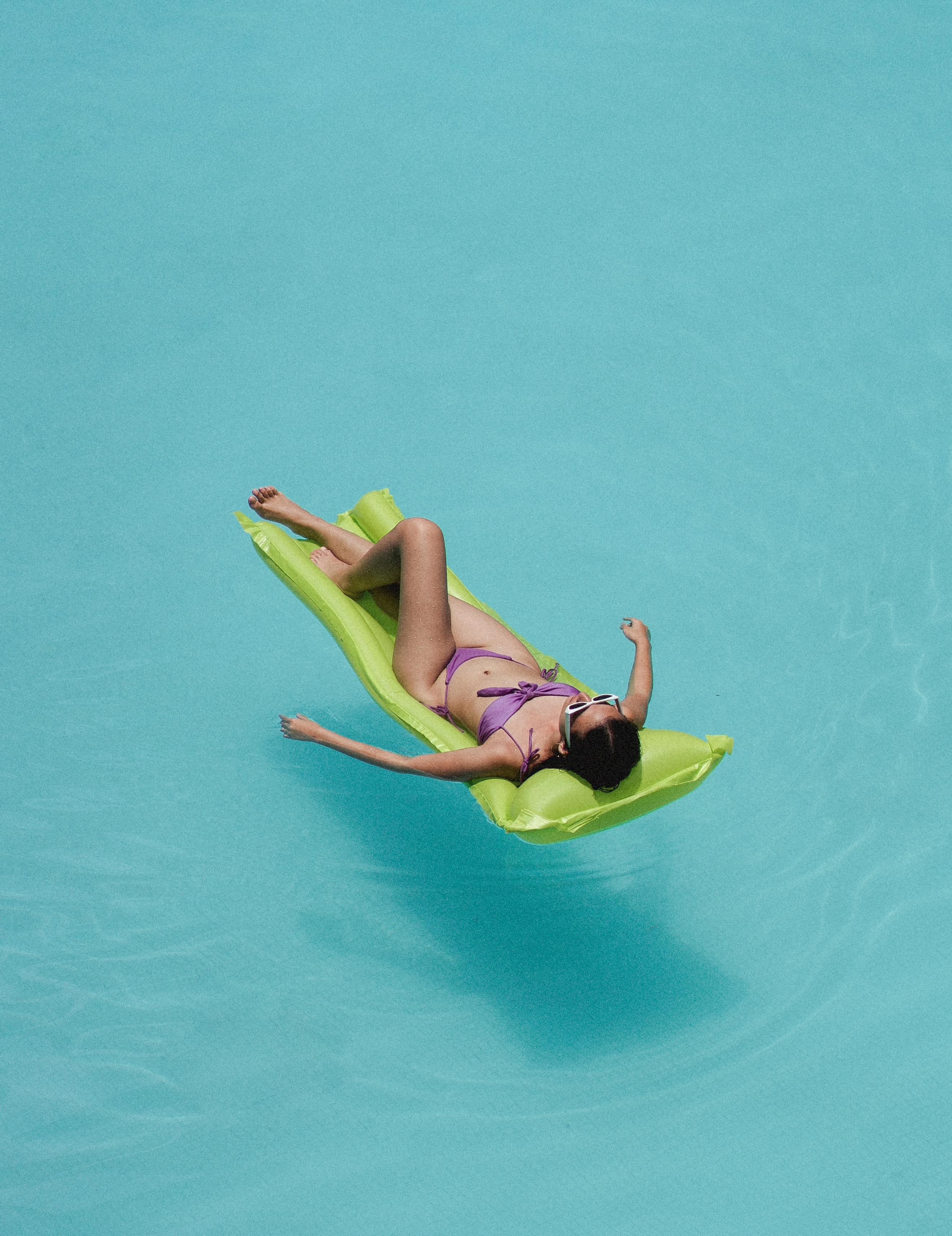 relaxed woman lying on air mattress