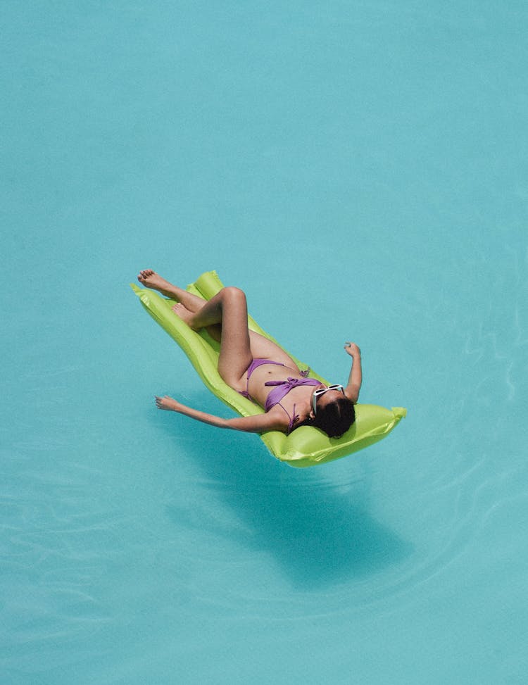 Relaxed Woman Lying On Air Mattress