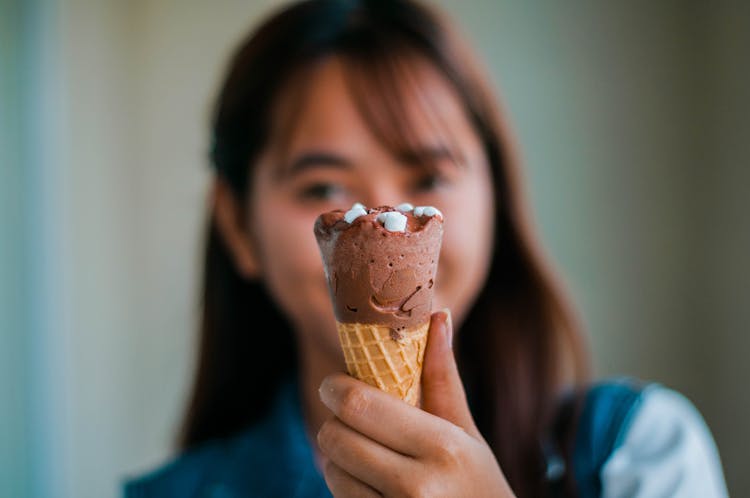 Anonymous Asian Woman With Ice Cream