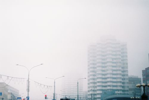 Free High-rise buildings shrouded in mist create a moody urban skyline. Stock Photo