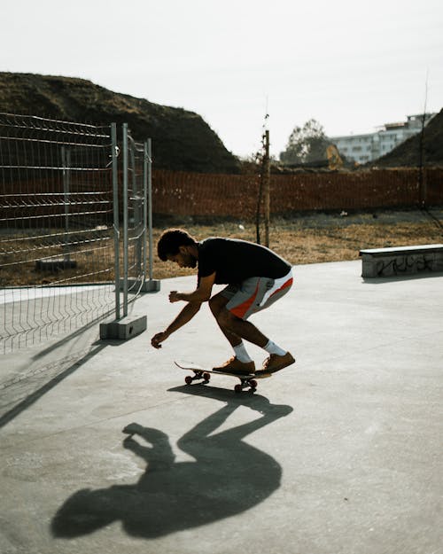 Man in Black T-shirt Skating