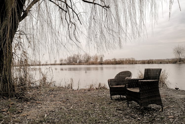 Two Chairs By A Lake