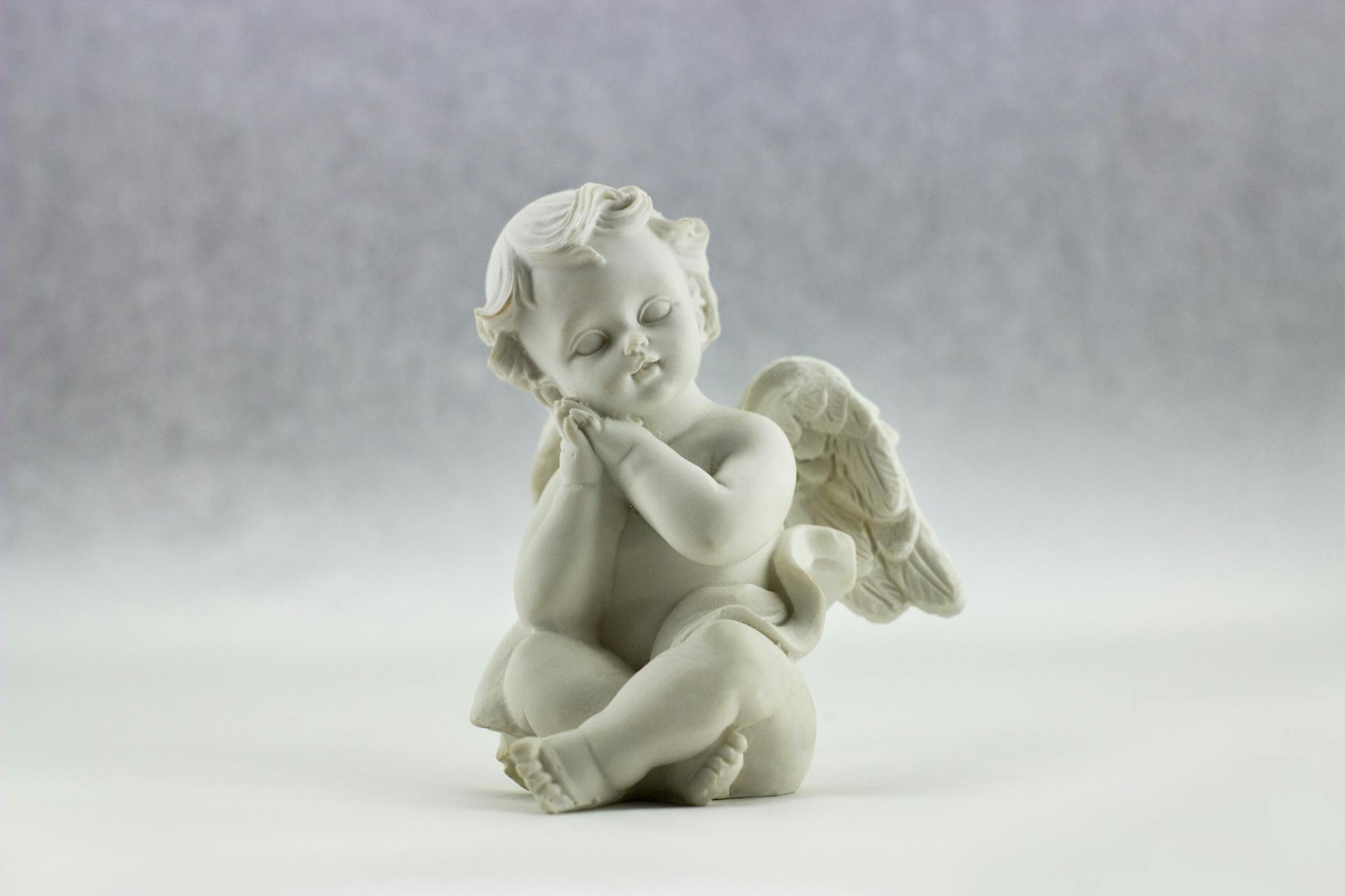 White Ceramic Figurine of Angel Illustration