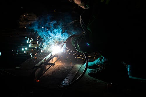 A Man Welding Metal