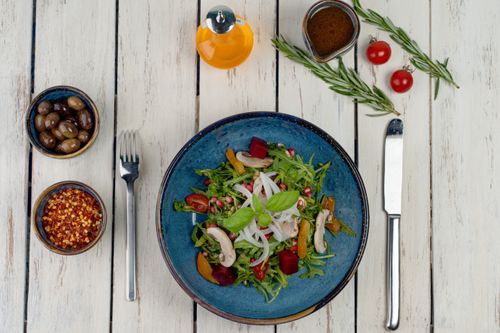 Free Vibrant vegetable salad with fresh herbs, ideal for healthy meals. Perfect for food photography enthusiasts. Stock Photo