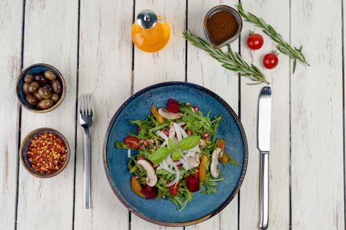 Free A vibrant vegetable salad with fresh ingredients, captured in an artistic flat lay. Stock Photo