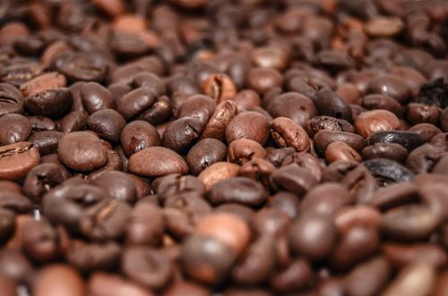 Free High-resolution macro shot of brown coffee beans, perfect for coffee-themed projects. Stock Photo