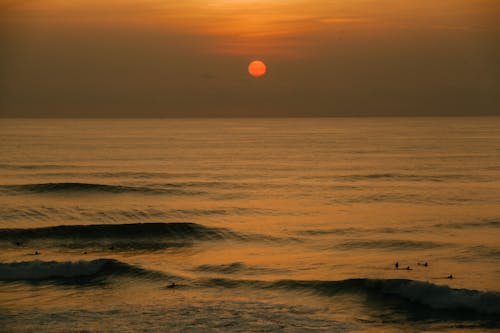 Amazing sunset over waving sea in evening