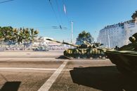 Green and Black Battle Tank on Road