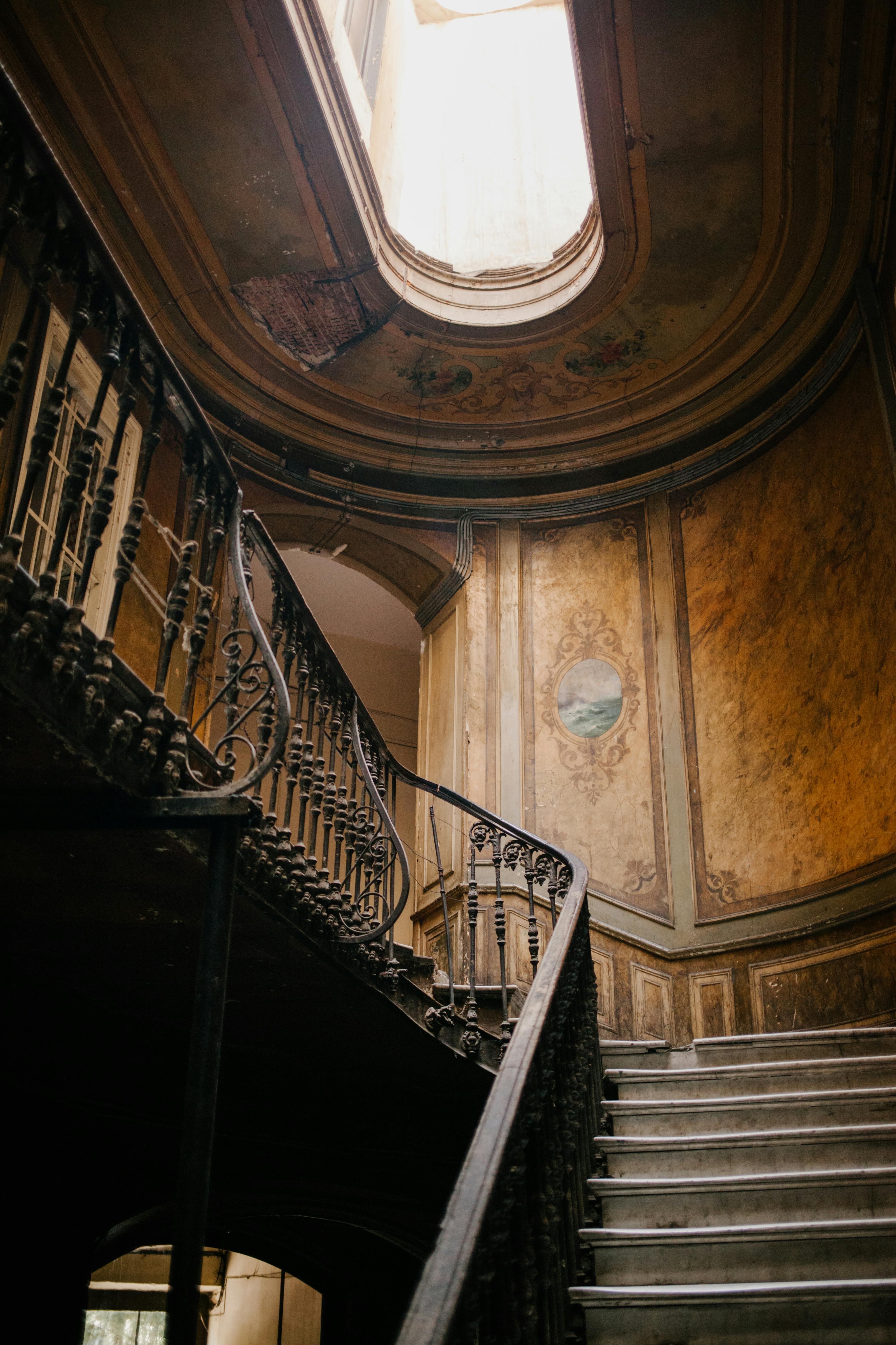 classic staircase in old building with hall in ceiling