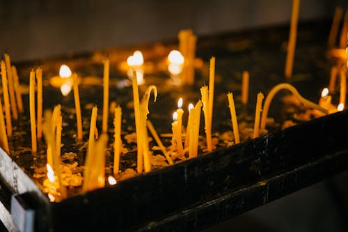 Free Glowing candles in holy place of church Stock Photo