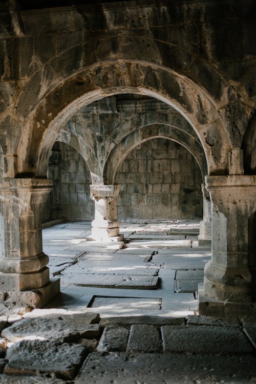 Arched passage in ancient palace with shabby walls