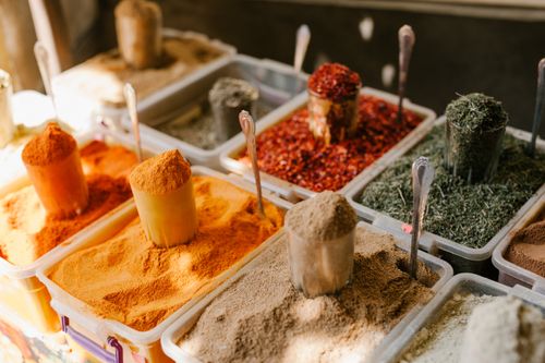 Free From above of plastic containers with different condiments for selling at local bazaar Stock Photo