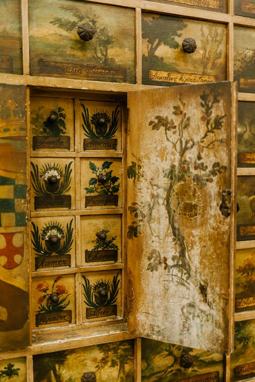 Old fashioned drawers with different paintings