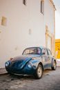 Old fashioned car on paved street