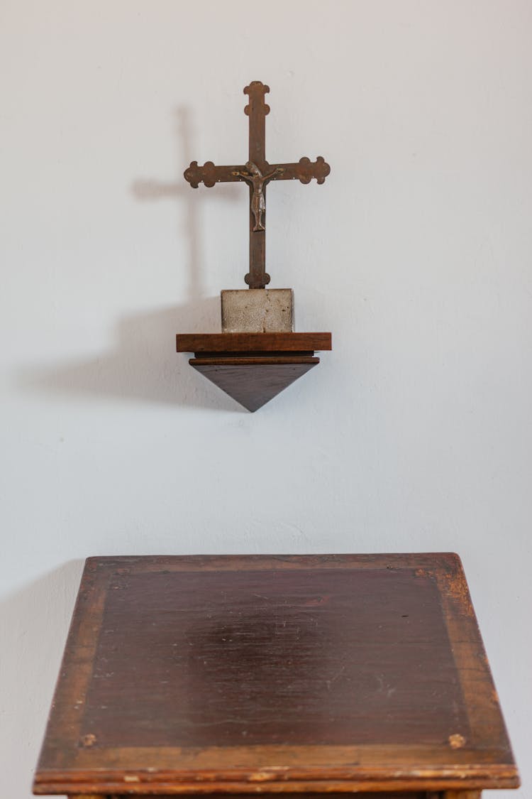 Old Wooden Pulpit With Cross On Wall