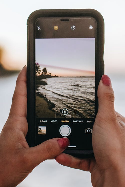 Close-Up Shot of a Person Taking Photo Using a Smartphone