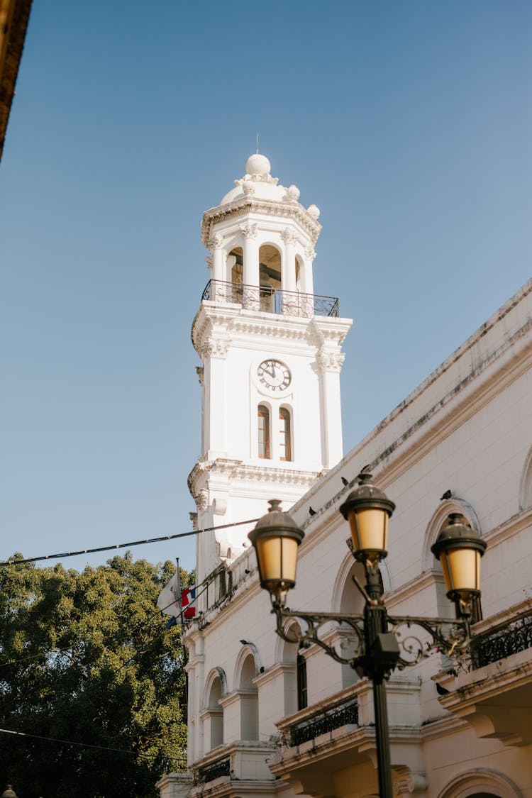 Old Bell Tower Of Stone Church In City