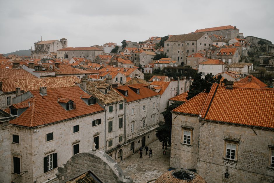 Tourists enjoying the historic Old Town of Dubrovnik, Croatia, highlighting the need for travel protection.