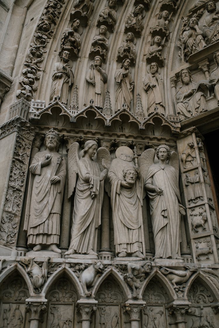 Medieval Statues Of Saints On Stone Entrance Of Church