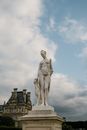 Old marble sculpture on pedestal in city