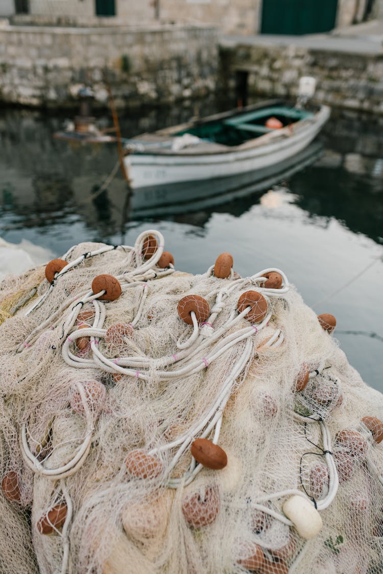 Fishing Nets In Heap On Coast Of Port