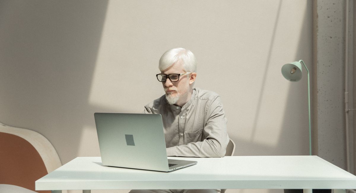 Man working on a laptop at a desk