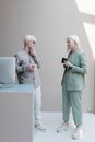 Busy albino colleagues having coffee break