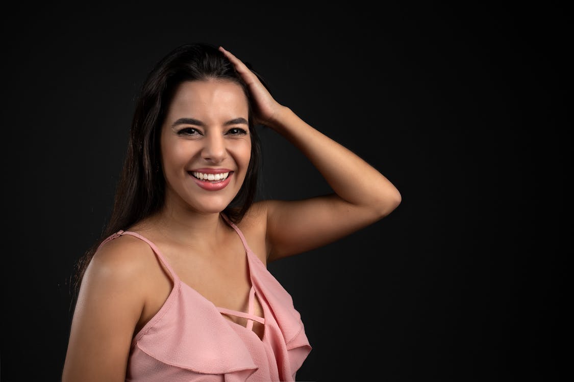 A Smiling Woman in Pink Halter Top