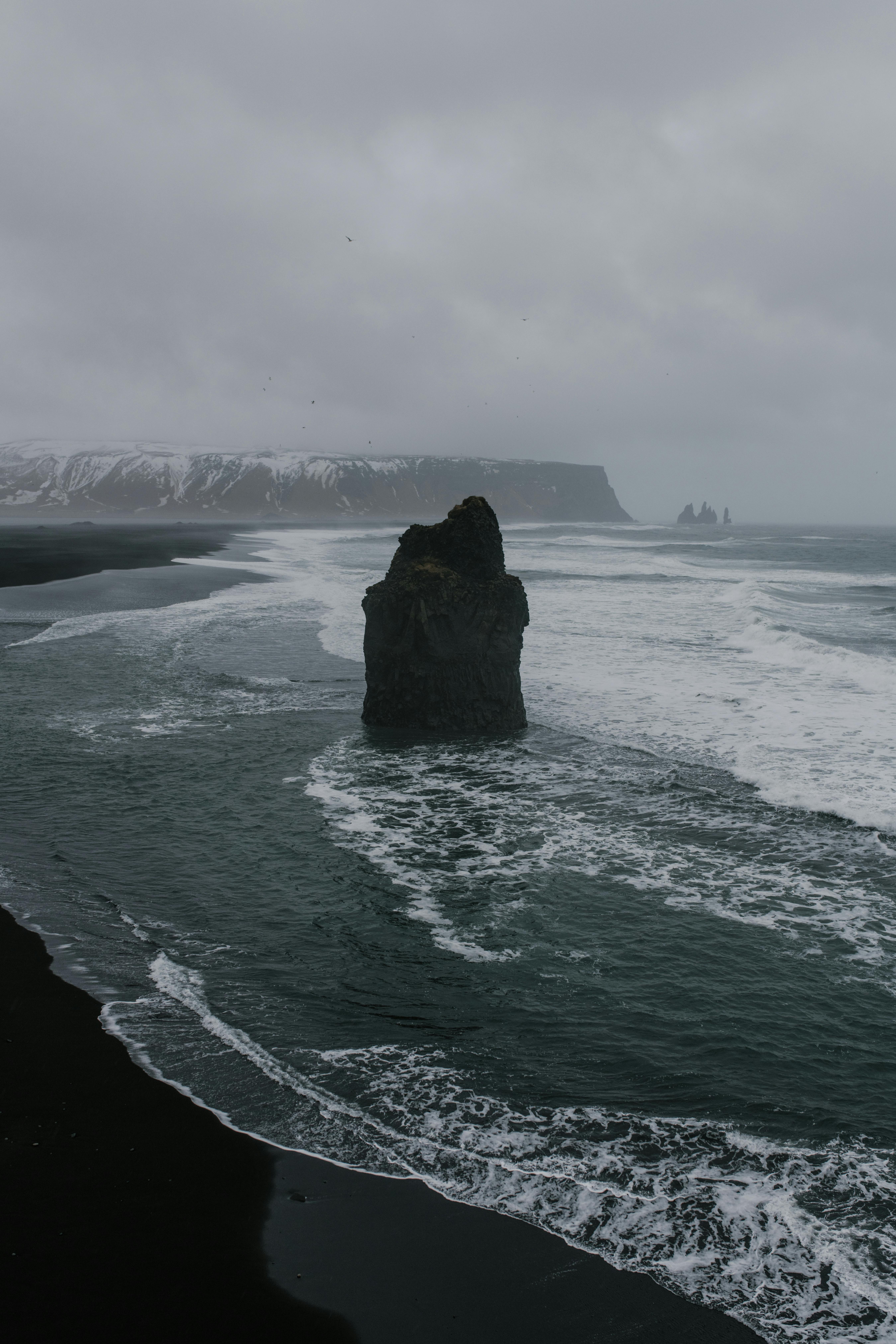 Black Rock Formation on Beach Shore · Free Stock Photo