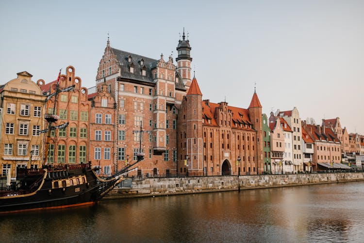 Old European City District On River Coast